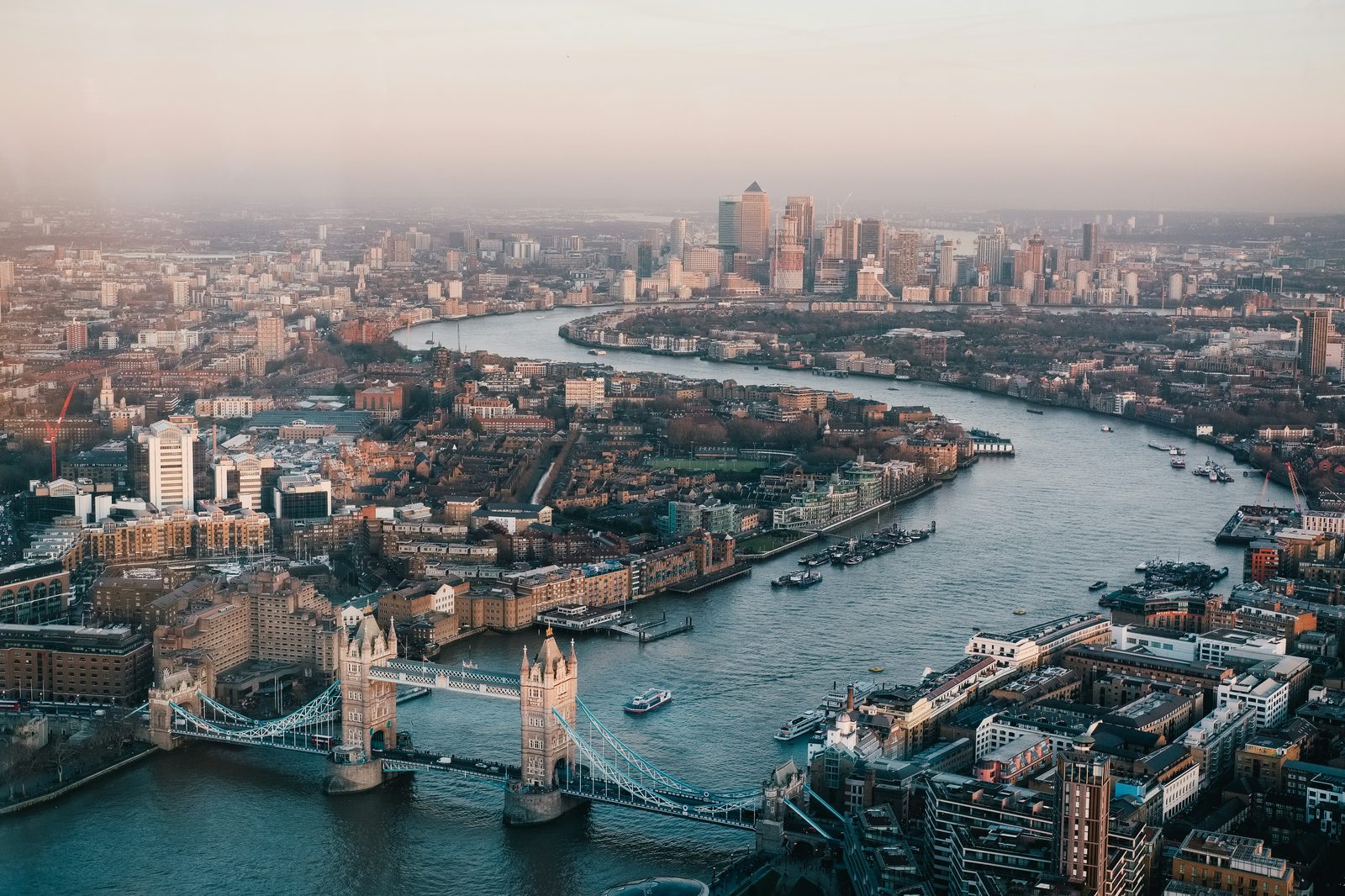 Aerial view of London with Tower Bridge and the Thames at golden hour